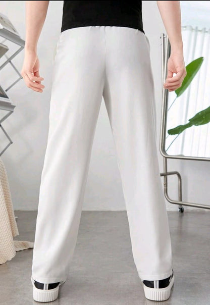 SHEIN Teen Boy Casual Tapered Pants With Pleat Design And Pockets